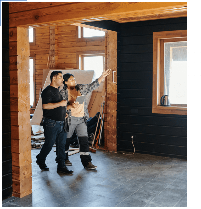 A man and woman standing in front of an easel.